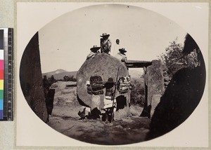 Group of men at ancient gateway, Madagascar, ca. 1890