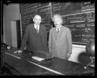 Richard C. Tolman and Albert Einstein standing in front of blackboard at California Institute of Technology in 1932