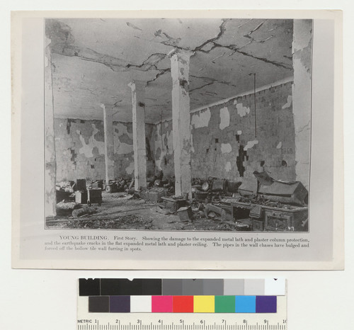 Young Building. First story. Showing the damage to the expanded metal lath and column protection, and the earthquake cracks in the flat expanded metal lath and plaster ceiling. The pipes in the wall chases have bulged and forced off the hollow tile wall furring in spots