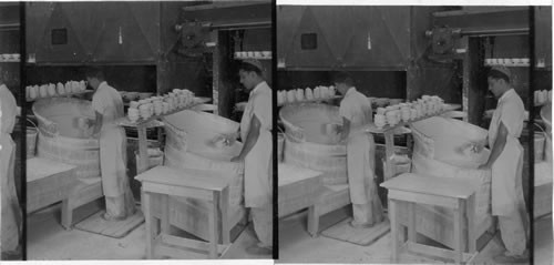 "Applying glaze to bisk" All ware is called "bisk" before it is glazed. "Lenox, Inc." Makers of fine chinaware, Trenton, N.J