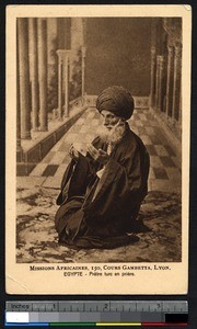 Turkish priest kneels in prayer, Egypt, ca.1900-1930