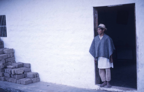 A man standing in the doorway, Tierradentro, Colombia, 1975