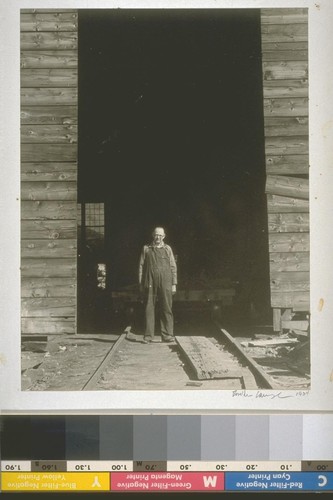 Machinist at door of machine shop, Oroville, Ca., 1934