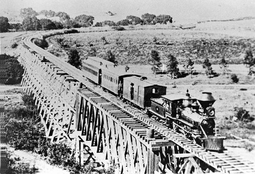 Santa Cruz Railroad passenger train crossing the trestle bridge in Capitola