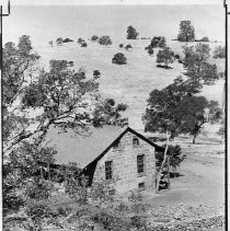 View of the Wildermuth House and the stone wall that surrounds it at Cam Seco ovrlooking the Pardee Reservoir in Calaveras County