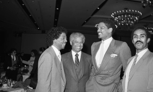 Willie West talking with Marques Johnson at the NBA All-Star Game dinner, Los Angeles, 1983