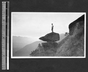 Missionary standing on Tipping Rock, Fuzhou, Fujian, China, ca.1946
