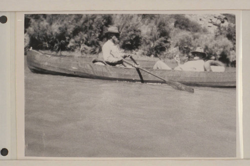 Dave Rust rowing one of his folding canvas boats in Glen Canyon. George Fraser sits in the stern. The river journey was from Hite to Lees Ferry