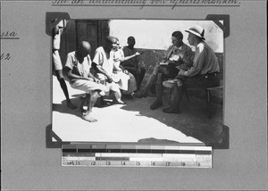 European doctors examining mentally ill Africans, Nyasa, Tanzania, 1929