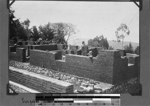 Bricklayers building up a house, Kyimbila, Tanzania, 1906
