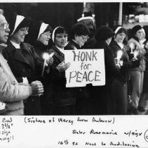 A group of Sisters of Mercy nuns from Auburn participate in an anti-nuclear weapons candlelight vigil