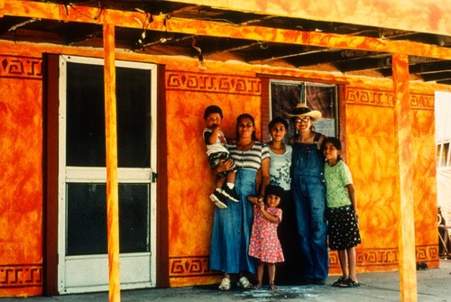 Project at Maclovio Rojas: painted and stenciled porch with family