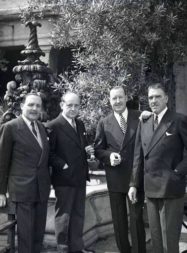Four Unidentified Men in Front of the Playhouse