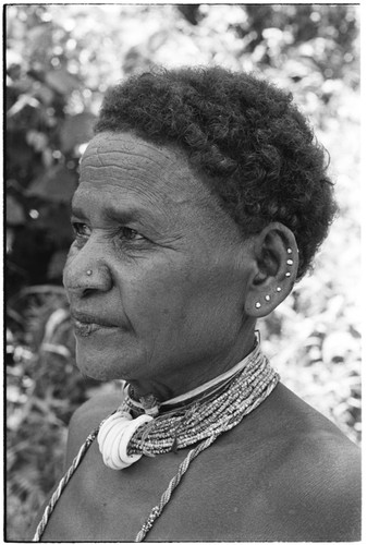 Portrait of 'Etenga wearing tale'ekobi necklace on 'afi'afi shell beads