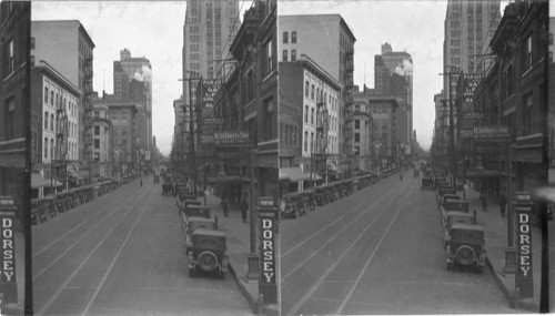 Looking west on Commerce St. from Poydras St., at right is the Santa Fe bldg. at left is the Magnolia bldg., Dallas, Texas