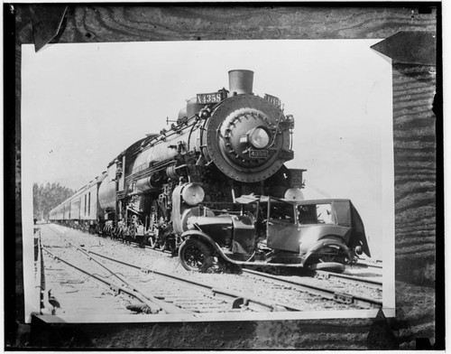 Locomotive 4358 and wrecked car on tracks