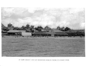 View of Redondo Beach from its first pier, showing the A.R. Schafers Casino, ca.1890