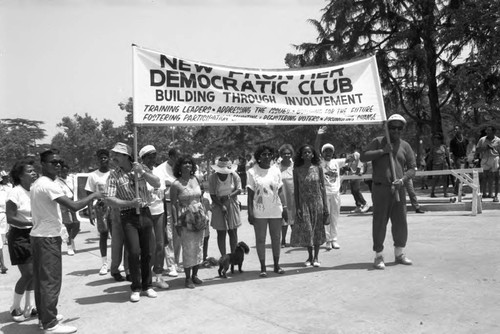 New Frontier Democratic Club members holding a banner during the Black Family Reunion, Los Angeles, 1989