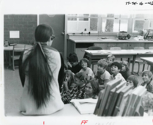 Student teacher reading to school children, mid 1970s