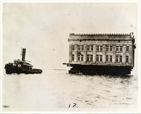 [Ohio State Building being transported by barge from the Marina in San Francisco to Belmont after the close of the Panama-Pacific International Exposition]