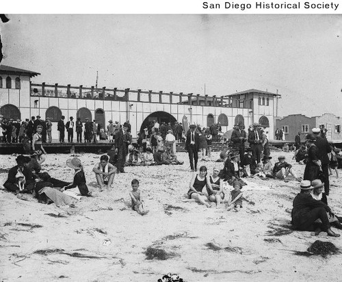 People sitting on the sand at Mission Beach