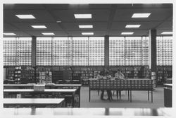 Patrons using the card catalog in the library, Santa Rosa