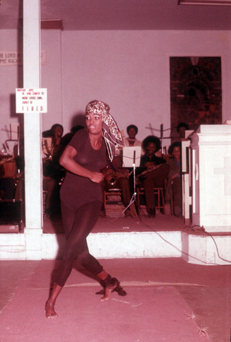 Woman dancing wearing a head scarf