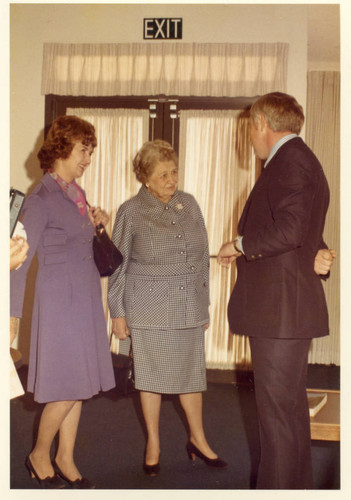 Mrs. Helen Young, Mrs. Phillips, and Dean Hudson inside the House