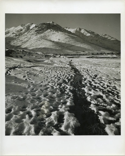 Path to distant Army base in winter landscape
