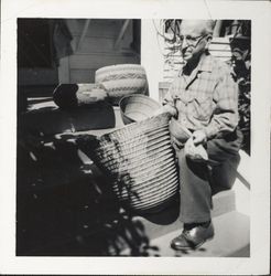William Borba with collection of Pomo Indian baskets