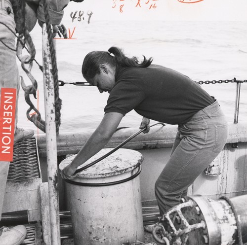 Helen K. Kirk on deck of the Scripps Institution of Oceanography research vessel, R/V Argo during the Nova Expedition (1967). The length of the hydrophone cables often needs adjusting in order to listen better for explosions. 1967