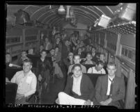 Interior of train car loaded with Citizens' Military Training Camps members leaving for summer camp, circa 1940