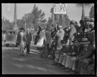 Street vendor selling seat cushions at the Tournament of Roses Parade, Pasadena, 1932