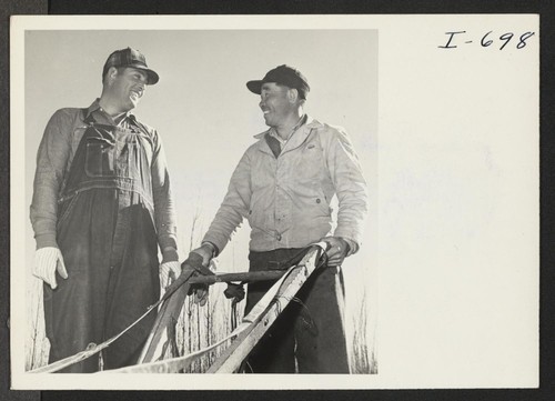 Kiiche Tange, employed at the Bowman Nursery between Amarillo and Hereford, Texas, is shown talking with B. H. Massey, a