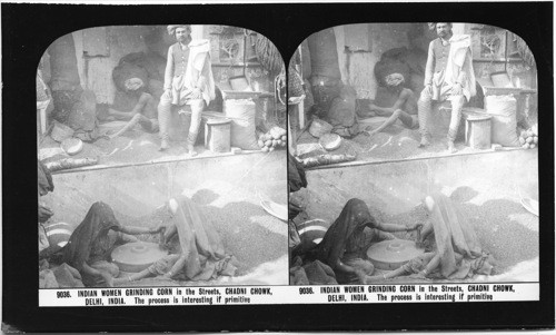 Inscribed on recto: 9036. INDIAN WOMEN GRINDING CORN in the Streets, CHADNI CHOWK, DELHI, INDIA. The process is interesting if primitive