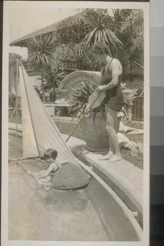 [Helen Wills? with girl in pool]