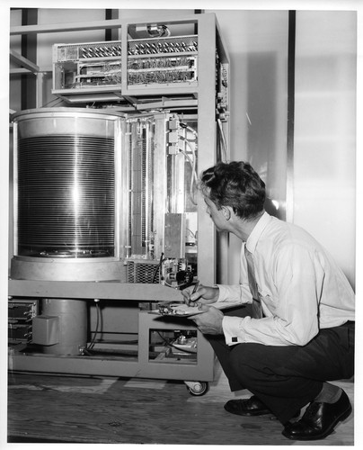 Unidentified Male Inspecting the Core of a Large IBM Data Processing Machine