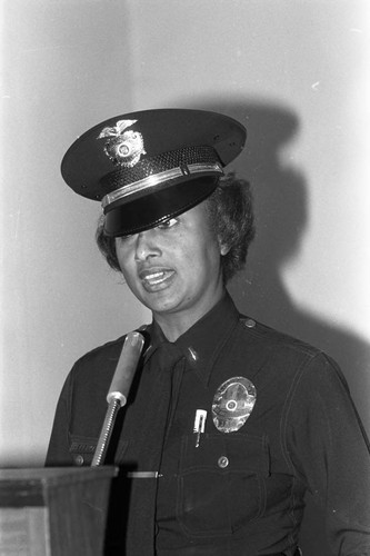 Policewoman at a lectern, Los Angeles