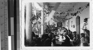 Father Arthur Allie, MM, sharing a meal with the congregation, Guatemala, ca. 1946
