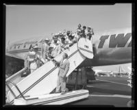 Chancellor Raymond B. Allen of UCLA says goodbye to students bound for India, 1953