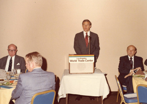 Dr. Banowsky at the podium, Dr. M. Norvel Young at the Right--World Trade Center (Color)