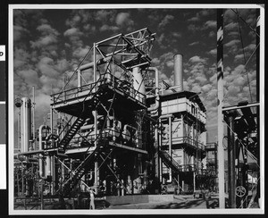 Shell Synthetic Ammonia Plant, showing platforms of cylindrical tanks in foreground, ca.1940