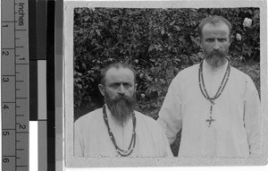Two priests posing for a portrait, Uganda, Africa, ca. 1920-1940