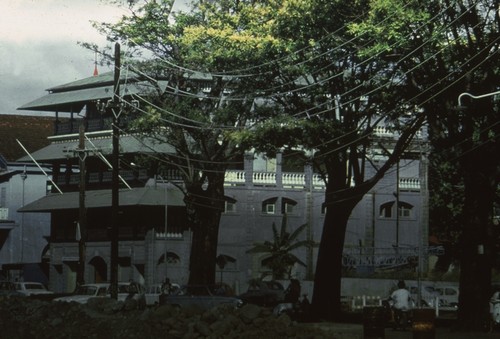 A large business building on the island of Tahiti, the largest island in the French Polynesia archipelago located in the South Pacific. Photo was taken by a crew member of the Capricorn Expedition (1952-1953) while visiting Tahiti. January 17, 1953