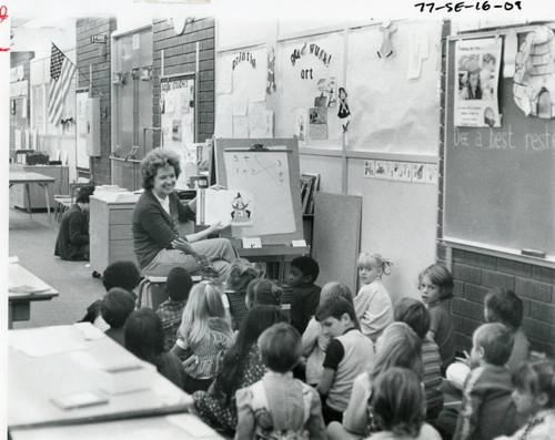 Student teacher reading to school children, mid 1970s (horizontal)