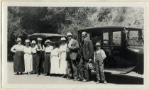 Group portrait in front of P.C.D.W. vehicles