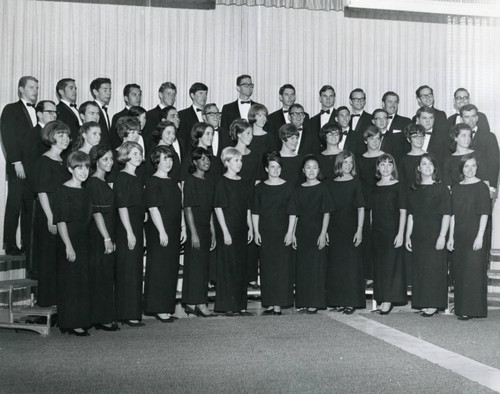 The Chorus in the Auditorium dressed in formal attire
