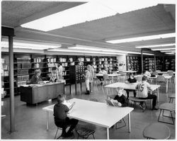 Mrs. Hahn, Librarian, assisting patrons of the Rohnert Park Library, Rohnert Park, California, 1968