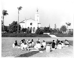 Class meeting outdoors in front of Sacred Heart Chapel