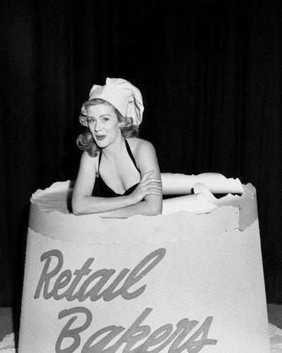 Woman in cake, Orange County Retail Bakers meeting, 1950